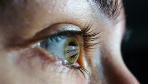 Image of an eye with Worldcoin logo, Worldcoing project key facts