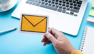 Yellow envelope in hand depicting email security