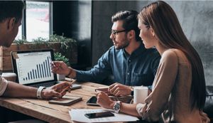 Business People Discussing Graph