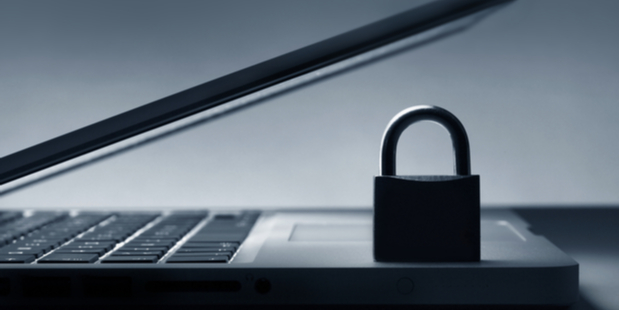 Cybersecurity intrusion detection system vs intrusion prevention system concept depicted with lock on laptop