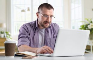 The laptop’s new job: Stop being an IT liability